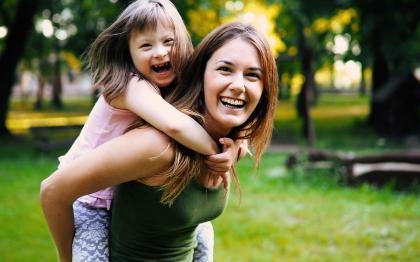 A mother and a child playing outside