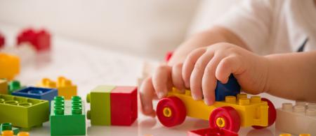 Child playing with Legos