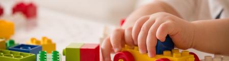 Child playing with Legos