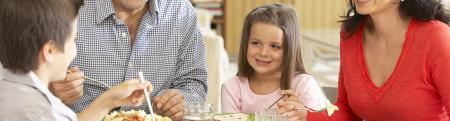 A happy family eating dinner