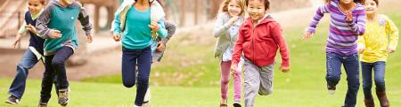 Group of kids running at a playground