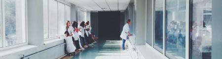 Medical professionals in a hospital hallway