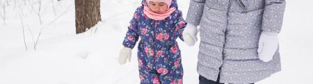 Child in winter with mother