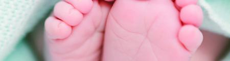 A close up of new born baby feet
