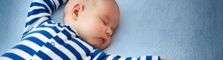 Baby in striped pajamas sleeping