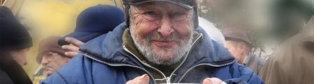 Man At Soup Kitchen Holding Food