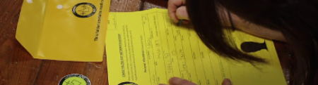 Still from a video showing YDP paperwork