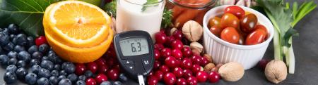 Fresh fruit and vegetables with glucose meter