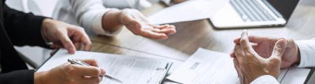 Closeup of business professionals hands in a meeting