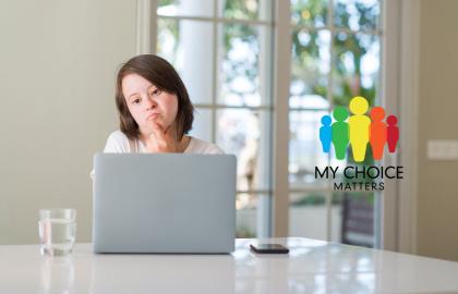 MCM Banner of girl with downs syndrome looking at a computer