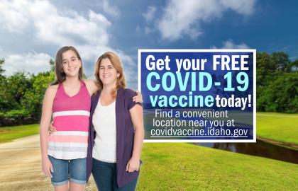 Mother and daughter stand in a park next to words saying Get your FREE COVID-19 vaccine today