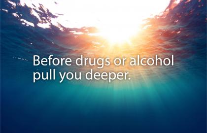 Banner with background of deep water with sun shining through the surface with words "Before drugs or alcohol pull you deeper."