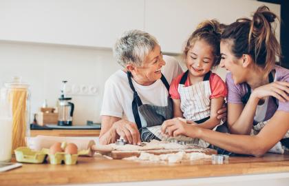 Hispanic Grandmother with her daughter and granddaughter in the kitchen