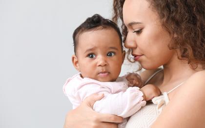 Mother holding young baby