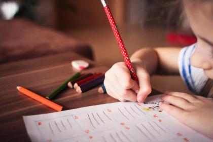 Close up of child writing