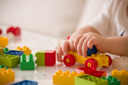 Child playing with Legos
