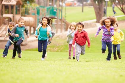 Group of kids running at a playground