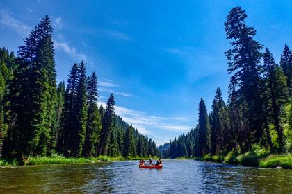 Group of people in a raft on a river