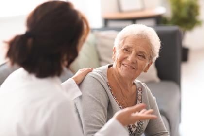 Older adult talking to a provider