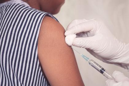 A child getting a shot in the arm