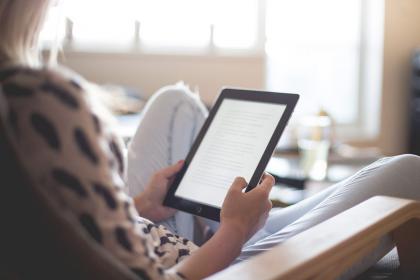 Adult holding a tablet