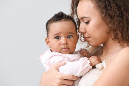 Mother holding young baby