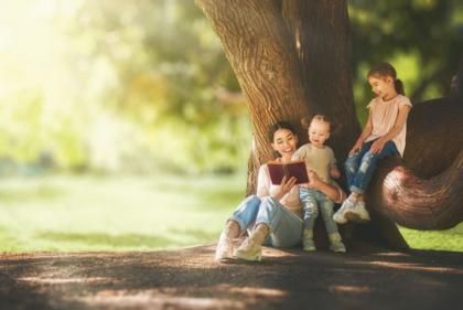 Mother reading to children