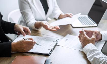 Closeup of business professionals hands in a meeting