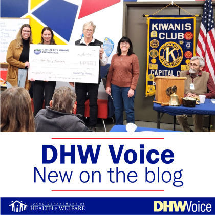 Kiwana's members donating check to DHW employees & IP&R